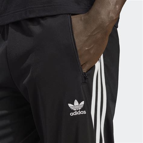 adidas trainingsbroek heren zwart drukknopen|adidas Originals .